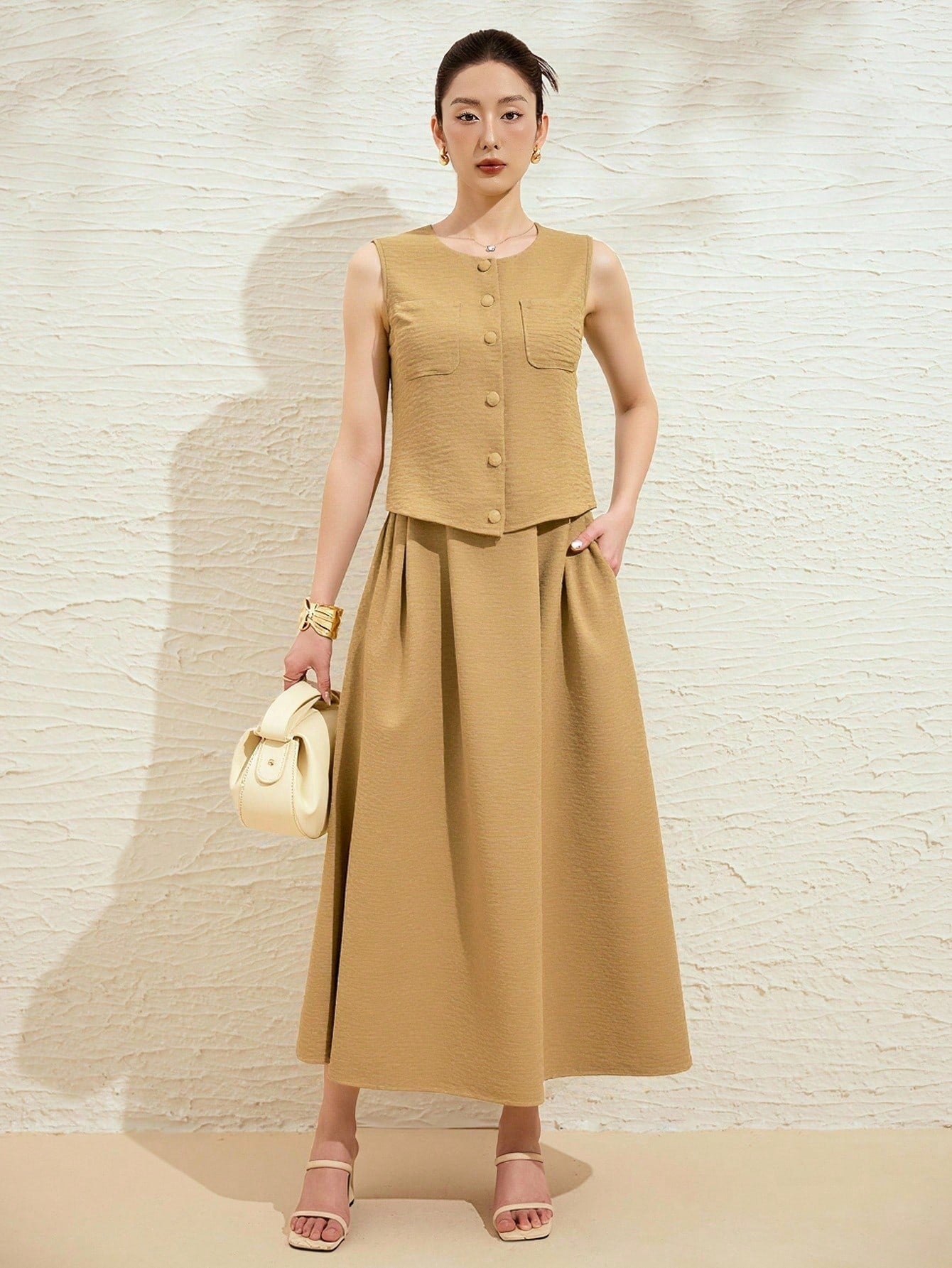 Effortlessly chic meets summer vibes with this gorgeous two-piece set! The soft tan blouse pairs perfectly with its matching skirt, creating an instantly polished look that works for everything from brunch dates to casual outings. The relaxed fit keeps you comfortable while the neutral tone plays well with your entire wardrobe. Whether you're dressing it up with accessories or keeping it laid-back, this set is your new go-to for looking put-together without trying too hard. Simple, stylish, and oh-so-wearab