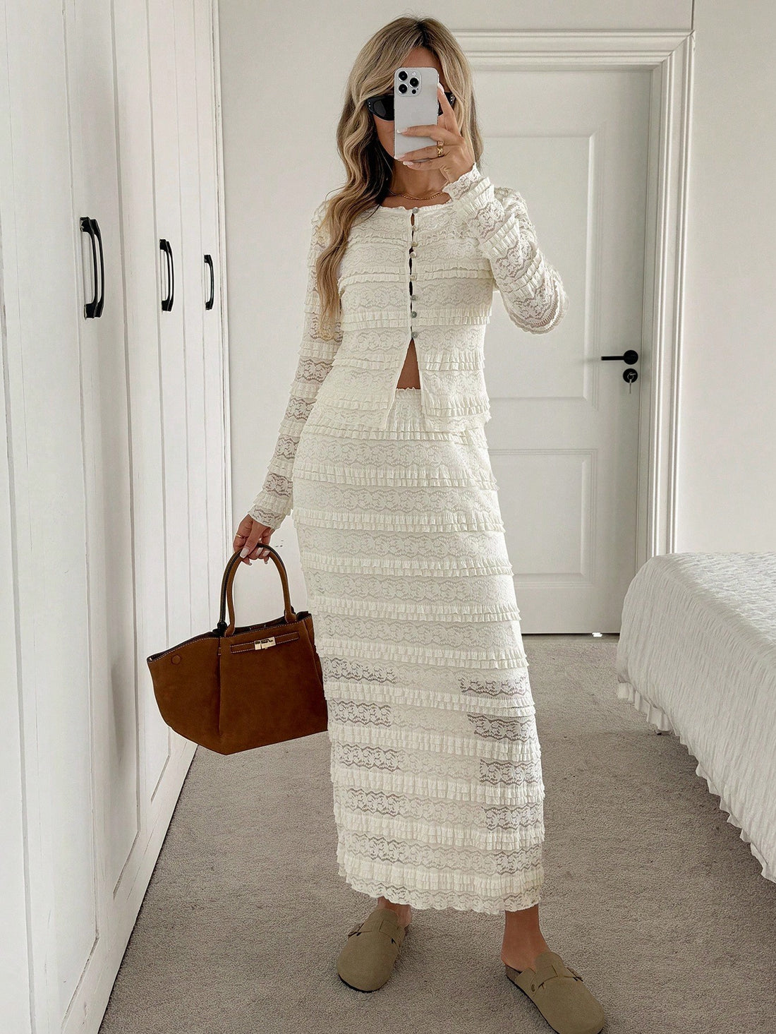 Elevate your cold-weather wardrobe with this chic two-piece set that's equal parts cozy and show-stopping. The fitted long-sleeve cropped tee pairs perfectly with a sleek bodycon skirt, creating an effortlessly polished silhouette that transitions from brunch to night out. Designed for autumn and winter layering, this set strikes the ideal balance between comfort and confidence. Whether you're dressing up or keeping it casual, this dynamic duo delivers major style points without the fuss.