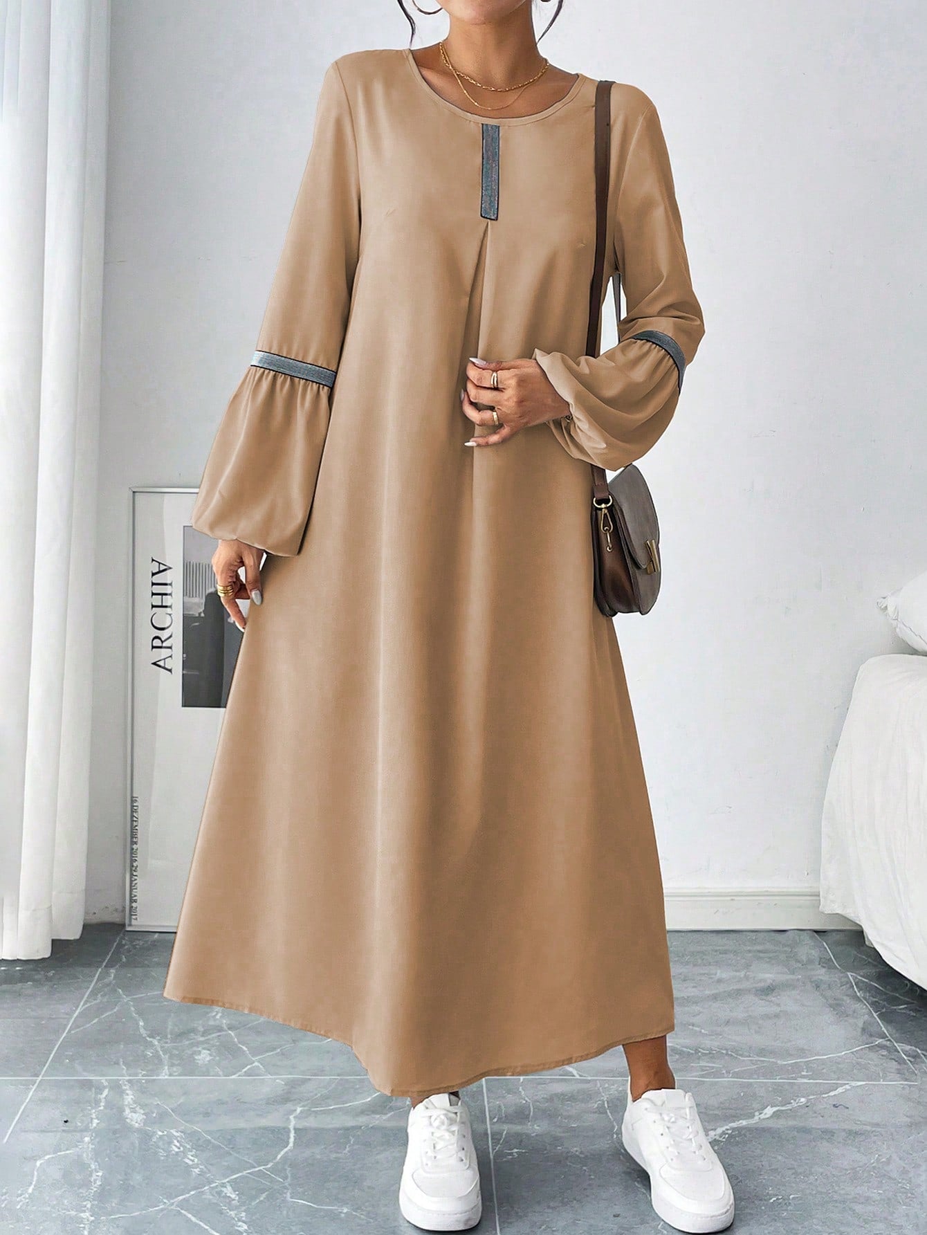 This dress is the ultimate blend of style and comfort. With its elegant woven belt and unique design, you'll turn heads while feeling at ease. Perfect for any occasion, this dress proves that fashion and comfort can coexist.