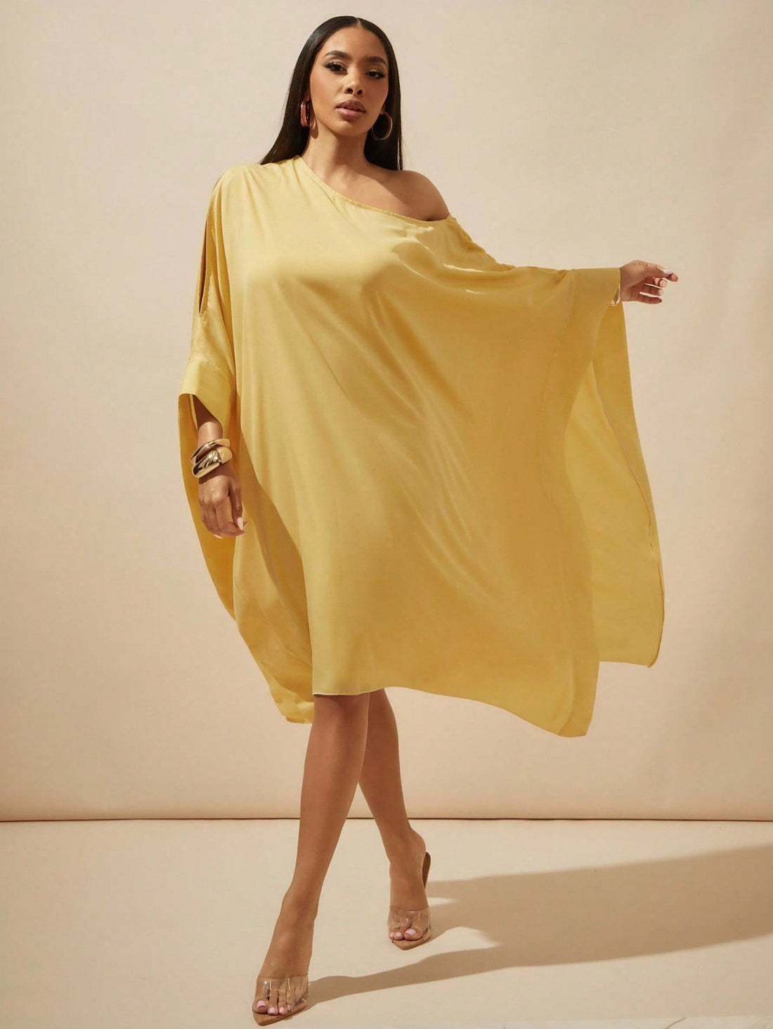 Step into the spotlight with this playful yellow batwing dress crafted from sheer chiffon. Its flowing ruffles add a flirty touch, perfect for turning heads on date nights or weddings. Lightweight and breezy, it moves with you, making every moment feel effortlessly elegant and fun.