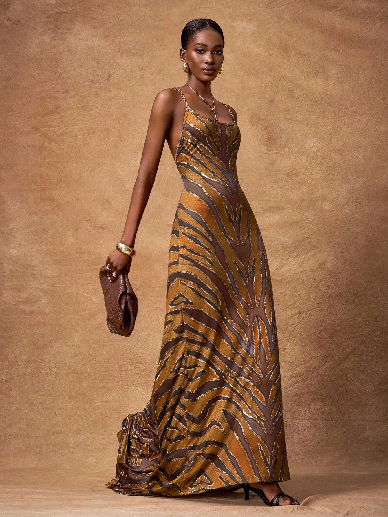 Make a statement with this stunning zebra print long dress that effortlessly transitions from day to night. The bold, eye-catching pattern brings instant personality to your wardrobe, while the flowing silhouette flatters every figure. Whether you're heading to a party, jet-setting across the globe, or simply elevating your everyday look, this versatile piece has you covered. Comfortable enough for all-day wear yet chic enough to turn heads, it's the dress that does it all. Embrace your wild side with timel