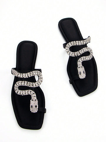 Discover the ultimate combination of elegance and comfort with our Elegantly Chic 3D Snake Crystal Chain Black Lycra Slip-On Flat Mule Sandals. Featuring a stunning 3D snake crystal chain design and a slip-on style for easy wear, these sandals are perfect for any occasion. Walk in style and comfort with our chic and trendy flats.