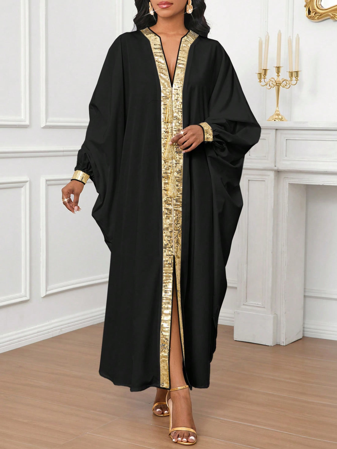 Get ready to shine in this Elegantly Chic Gold Sequined Burqa Dress for Women! Featuring stunning sequins and unique dolman sleeves, this dress will make you stand out at any event. With its elegant and chic design, you'll feel both stylish and comfortable in this must-have dress.