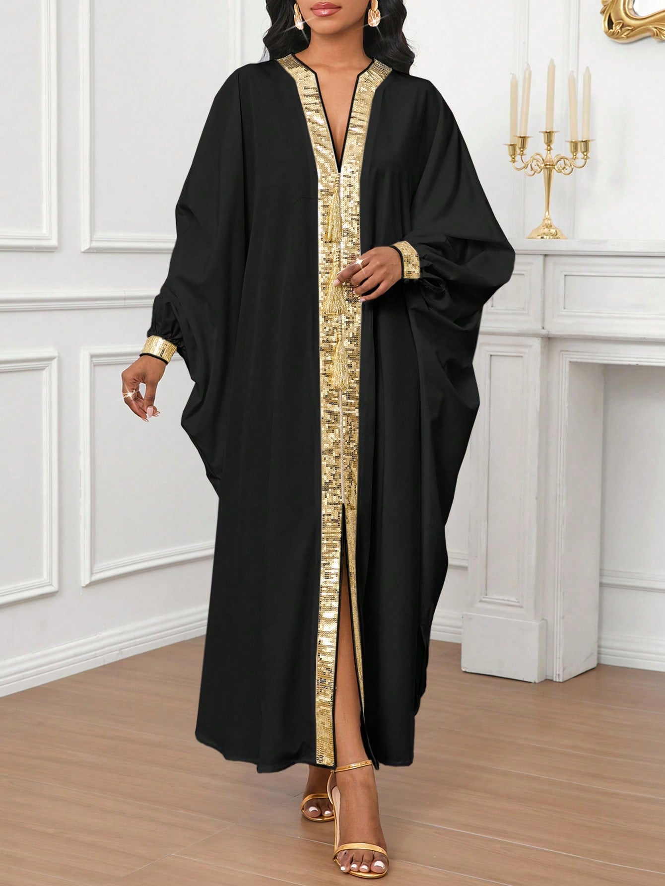 Get ready to shine in this Elegantly Chic Gold Sequined Burqa Dress for Women! Featuring stunning sequins and unique dolman sleeves, this dress will make you stand out at any event. With its elegant and chic design, you'll feel both stylish and comfortable in this must-have dress.