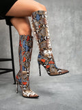 Add a playful and vibrant touch to your wardrobe with our Elevate Your Style: Colorful Snake Pattern Knee-High Stiletto Boots. These unique boots will elevate your style while making a statement with their eye-catching snake pattern. Perfect for any fashion-forward individual looking to stand out from the crowd. (No snakes were harmed in the making of these boots!)