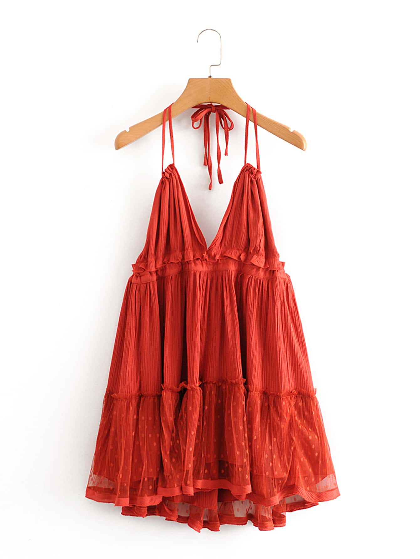 Unleash your fashion game with the playful Rosie layered halter dress! Elevate your style with this open-back piece, perfect for a night out with friends or a special date. Confidence and style will be effortlessly achieved with this unique and daring piece.