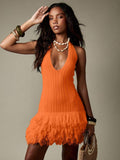 Turn heads effortlessly in this playful halter neck mini sweater dress, designed with a plush texture and a fun feather fringe hem. The cozy knit hugs your silhouette while the feather detailing adds a flirty, feather-light finish, perfect for dancing the night away or making a chic statement at your next party. Embrace comfort and style in one irresistible piece.