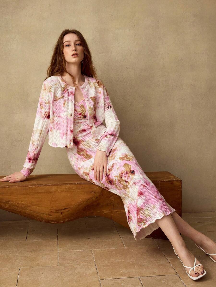 Discover timeless sophistication with this premium printed textured knit cardigan and dress collection, designed for the modern wardrobe. Each piece features an enchanting botanical print in vibrant multicolor hues, embodying a relaxed boho aesthetic. The round neckline and button-front design offer effortless styling versatility. Made from a breathable blend of 72% polyester and 28% viscose with exceptional stretch, these pieces move with you throughout your day. Long sleeves and a regular fit provide flat