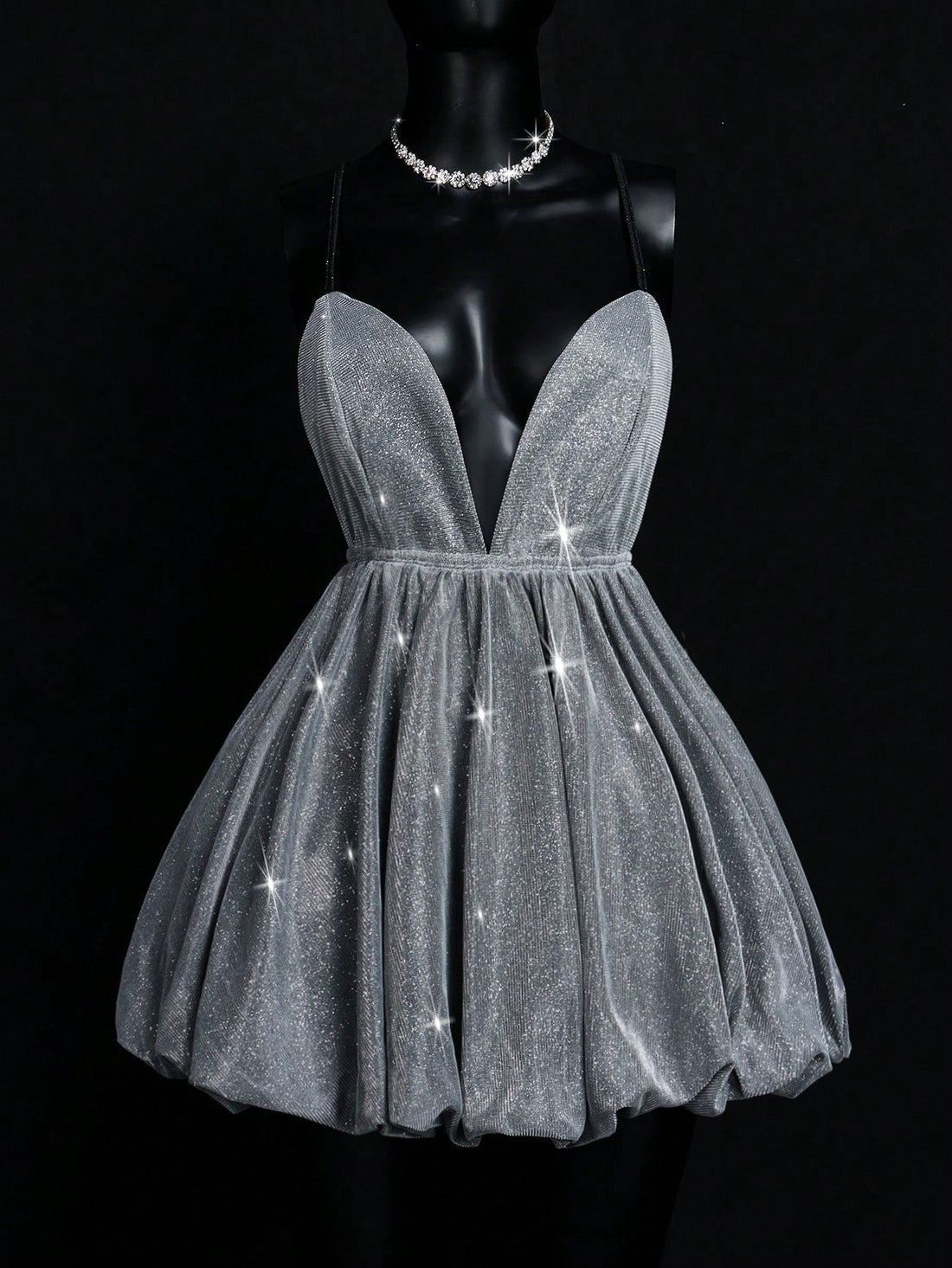 Shimmer and shine your way through any soirée in this eye-catching Silver Metallic Deep V Cami Dress! With its flirty neckline and party-ready metallic finish, you'll be turning heads faster than a disco ball. Perfect for fancy tea parties where you want to be the sugar cube that sparkles, or night events where you're aiming to outshine the moon. Slip it on and watch your confidence level skyrocket!