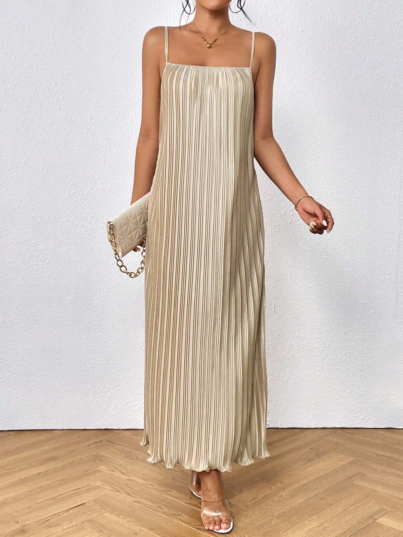 Elevate your style with the Solid Plisse Cami Dress - the perfect blend of style and comfort. This dress features an elegant design and a comfortable fit, making it perfect for any occasion. With its lightweight and breathable fabric, you'll look and feel your best all day long. 