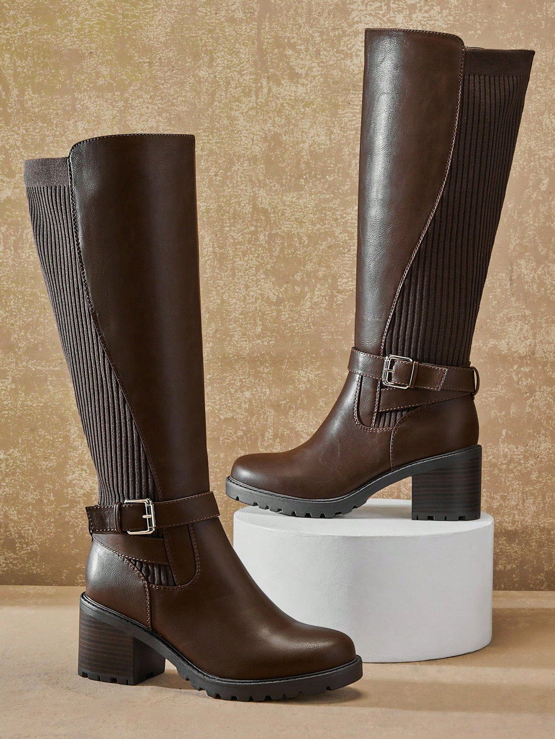 Step into confidence with these chic knee-high boots that blend comfort and style effortlessly. The sturdy block heel keeps you grounded all day long, while the trendy buckled strap adds an edgy touch to any outfit. Whether you're dressing up for a night out or keeping it casual, these versatile boots deliver the perfect balance of support and sass. Elevate your wardrobe with a pair that's as comfortable as it is fabulous!