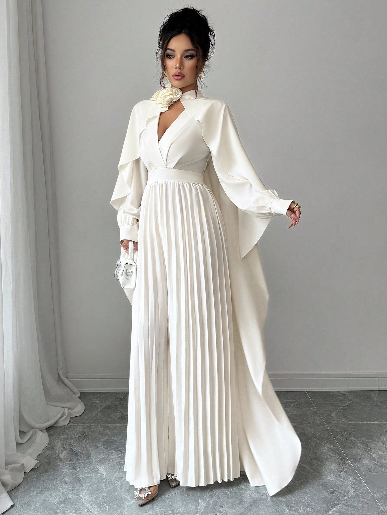 Make a statement with this stunning Elenzga 2-piece set that transforms your everyday wardrobe into something extraordinary. The luxe shawl collar top pairs perfectly with the eye-catching 3D floral wide-leg jumpsuit, creating an effortlessly chic ensemble that works for brunch, date night, or any occasion demanding a little extra pizzazz. The flowing silhouette flatters every figure while the dimensional florals add depth and visual interest. Whether you're channeling your inner fashionista or just ready t