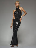 Turn heads and sparkle all night in this Futuristic Sequin Maxi Dress. Featuring a chic halter neck and a playful cut-out bow detail, it brings a touch of glam and whimsy to any occasion. Perfect for dancing under the stars or making a bold statement at your next event. Embrace your inner diva with effortless shine and style.