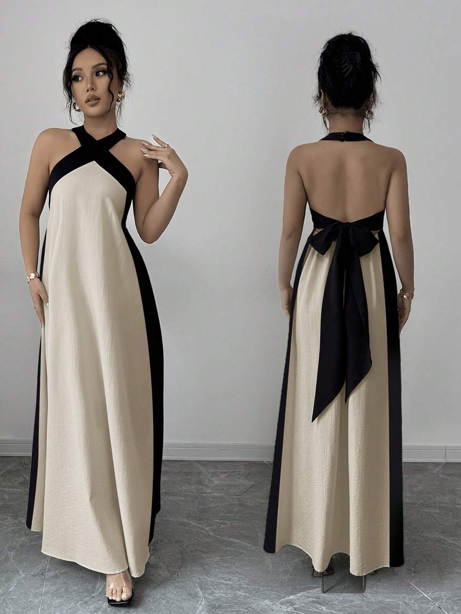 Step into summer fun with this vibrant Women's Bohemian Colorblock Halter Dress. Its playful mix of colors and breezy halter design keep you cool and stylish at every festival, beach day, or backyard party. Lightweight and flattering, it lets you move freely while turning heads wherever you go. Add a splash of carefree charm to your wardrobe with this effortlessly chic dress.