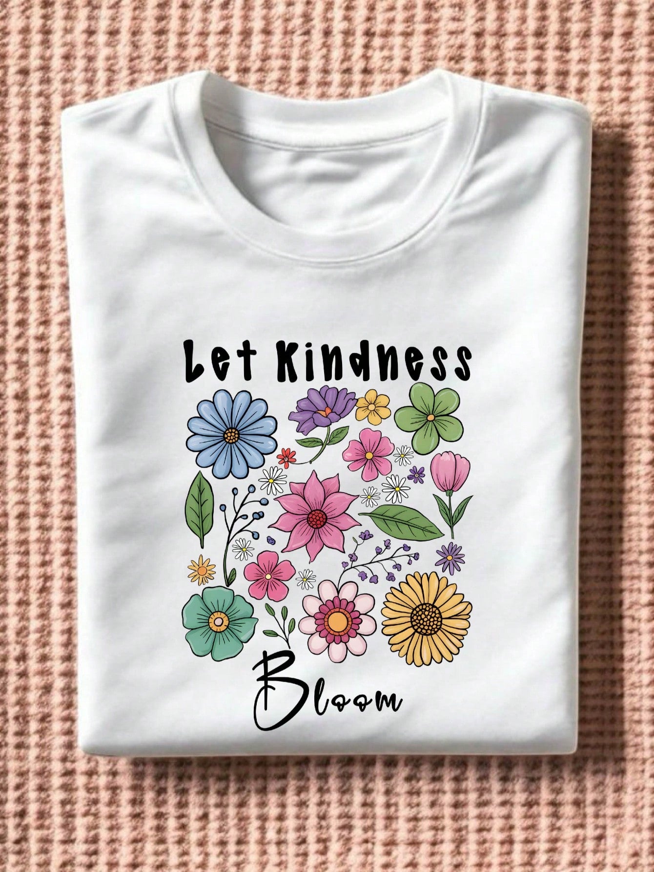 Celebrate good vibes with the Let Kindness Bloom Floral T-Shirt! This playful, short-sleeve boho tee for women features a charming floral design that inspires positivity wherever you go. Perfect for brightening your day and spreading kindness in style. Comfortable and easy to wear, it’s your new favorite reminder to let kindness grow.