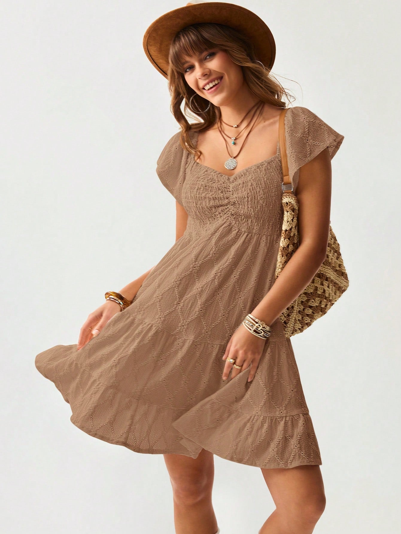 Twirl into summer adventures with this dreamy white mini dress! Delicate ruffles and lace details add a touch of Western romance to your vacation wardrobe. Perfect for beach strolls, outdoor brunches, or sunset cocktails. This playful piece combines casual comfort with head-turning style – just add your favorite sandals and you're ready for whatever the day brings!