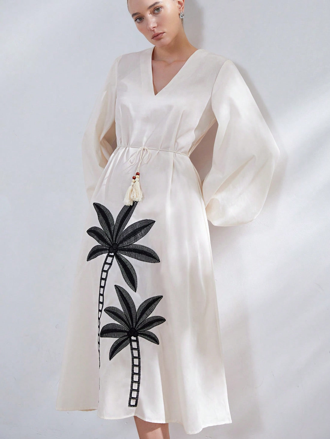 Step into sunshine with the Embroidered Palm Maxi! Featuring a flirty V-neck, breezy bell sleeves, and a playful high-low hem, this dress dances with every step. The drawstring weave belt cinches your waist just right, adding a touch of charm to your effortless style. Perfect for twirling through warm days and balmy nights!