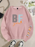 This empowering sweatshirt for women features a bold 'Be You, You Are Enough' letter print, inspiring individuals to embrace their true selves. Made with quality materials, this sweatshirt is not only stylish but comfortable, allowing you to confidently express yourself and spread a positive message to others.