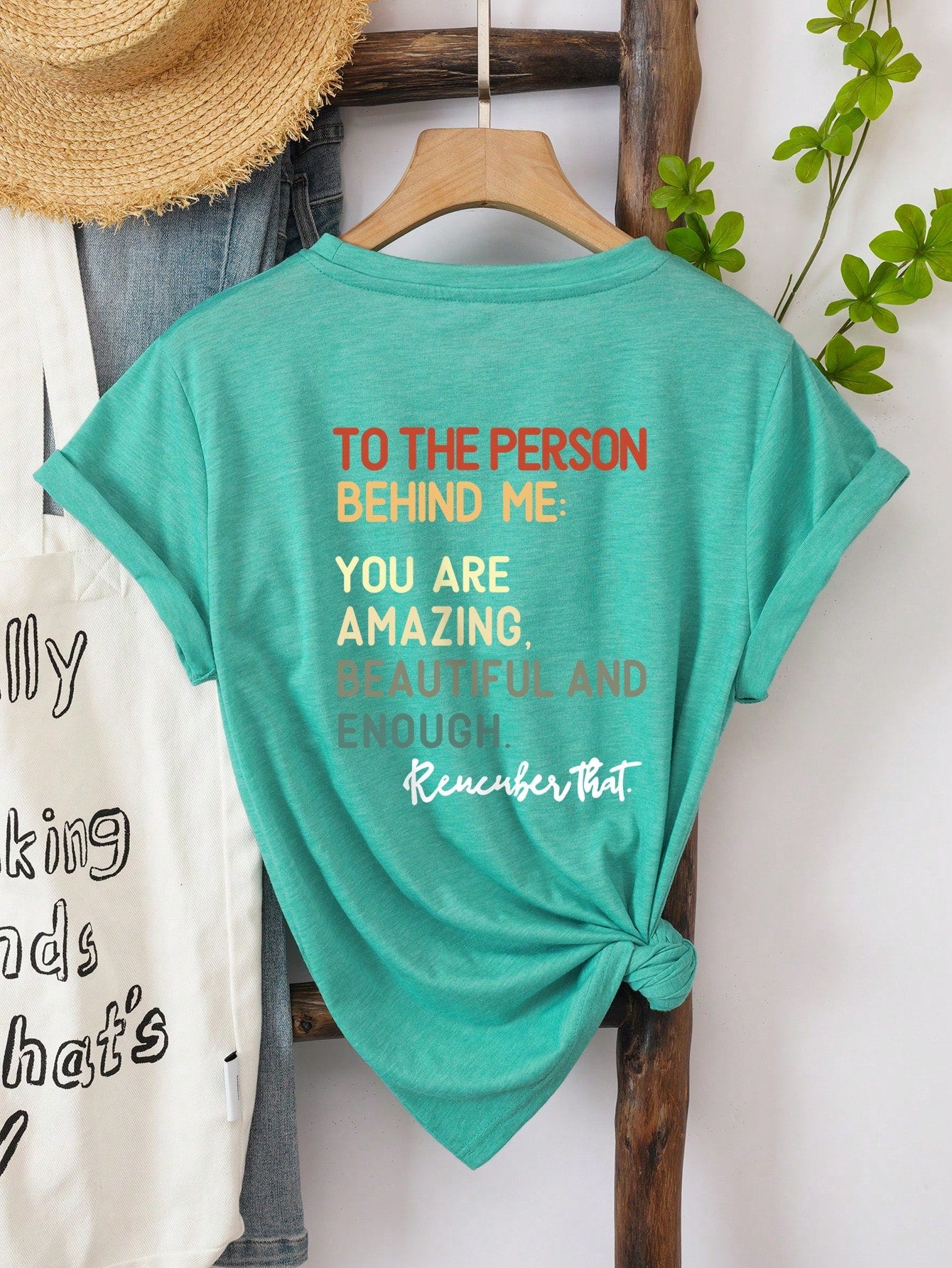 Show off your confidence with our Empowering 'To the Person Behind Me' Graphic Tee! Embrace your beauty and strength in this quirky and playful shirt. Let those behind you know they're following someone fierce. (Cliché-free and under 50 words!)