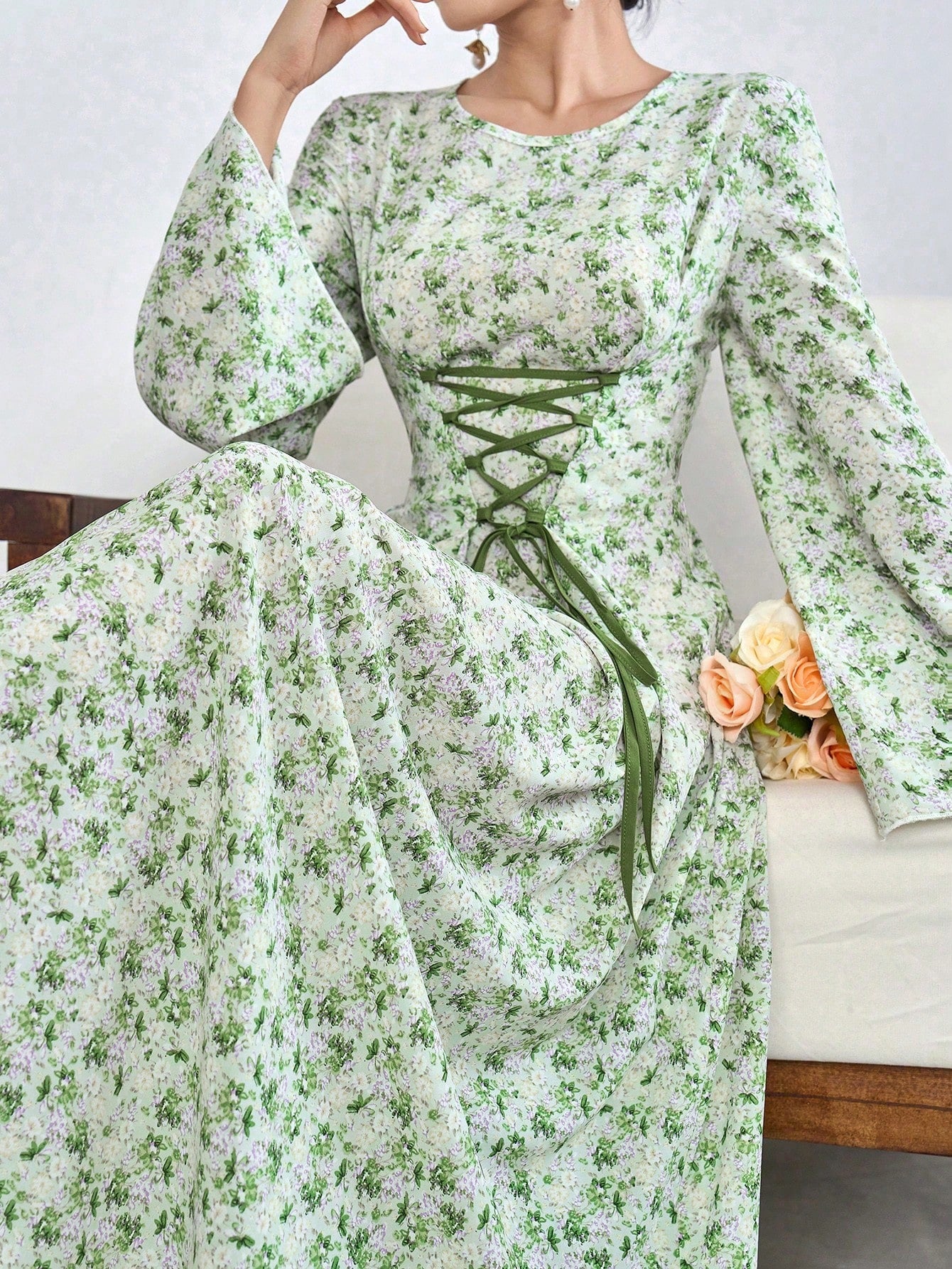 This exquisite Arabian dress features a captivating ditsy floral design and a lace-up front for a touch of effortless elegance. Made with high-quality materials, it effortlessly combines style and comfort for a truly enchanting look. Elevate your wardrobe with this must-have dress.