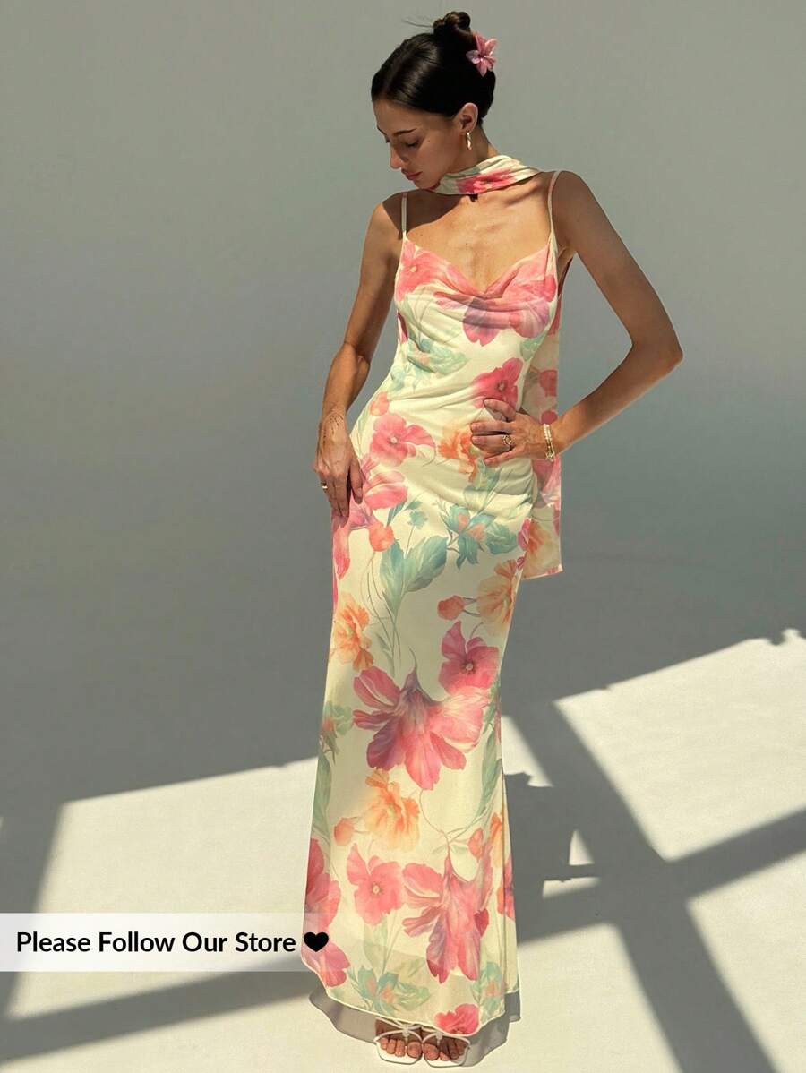 Elevate your garden party ensemble with this enchanting floral dress, designed to captivate with its delicate details. The sheer mesh construction showcases an exquisite floral pattern while the backless silhouette and spaghetti straps create an effortlessly sophisticated look. A flowing scarf collar adds movement and elegance, framing the neckline beautifully. Perfect for outdoor celebrations, this dress balances femininity with modern style, offering a memorable impression at any garden gathering.