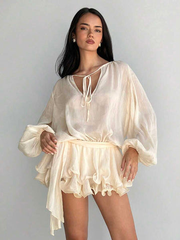 Step into a world of sparkle and charm with this glittering mini dress. Featuring whimsical lantern sleeves and a flirty ruffled hem, it’s designed to make every evening feel like a fairy tale. Perfect for twirling under the stars and turning heads wherever you go.