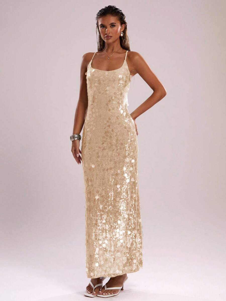 Dazzle in this stunning mint green sequin halter neck dress, the perfect choice for summer beach vacations and unforgettable parties. Featuring a sleek backless design with a flattering spaghetti strap neckline, this maxi dress combines elegance with eye-catching sparkle. The all-over sequin detailing catches light beautifully, while the side slit adds movement and sophistication. Crafted from a comfortable polyester-elastane blend with slight stretch, the lined construction ensures a smooth silhouette. Ide