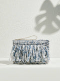 Blue gray white tie dye fabric tassel clutch with woven body zipper top and beige wrist strap