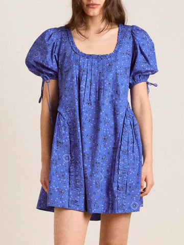 Front view of cobalt blue paisley smock mini dress with ruffled neck and puff sleeves