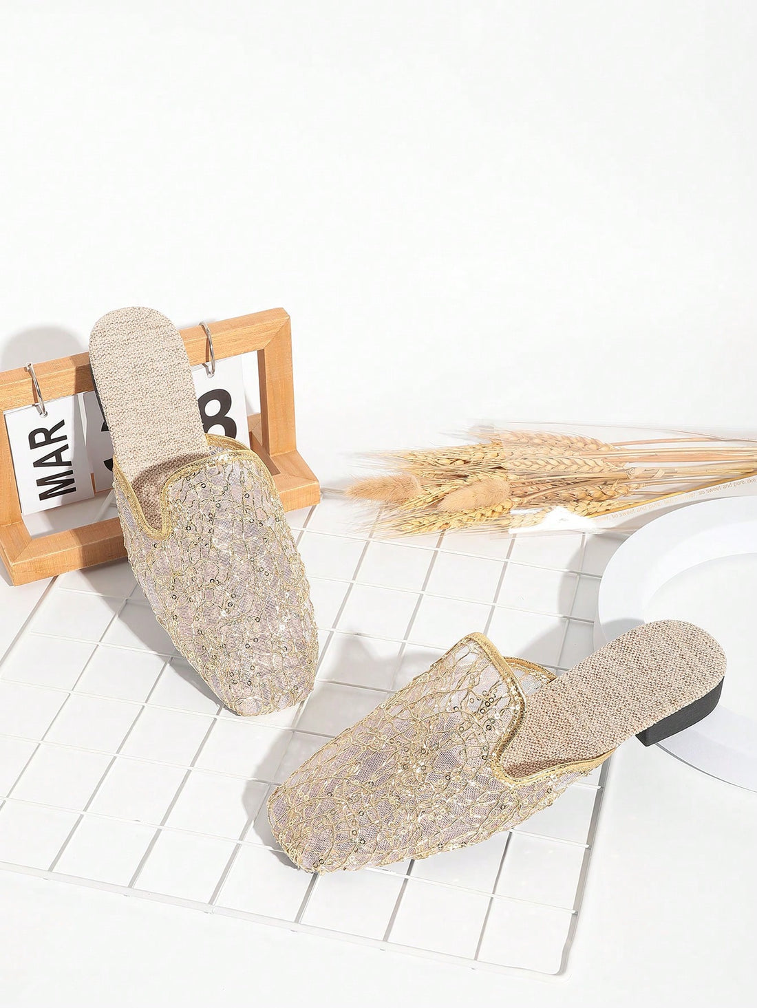 Elevate your style with these Fashionable Black and Gold Slip-On Mules! The glitter detail adds a touch of sparkle to these mid-heel sandals, perfect for effortless style. Slip them on and stand out in the crowd. Who says comfort and fashion can't go hand in hand?
