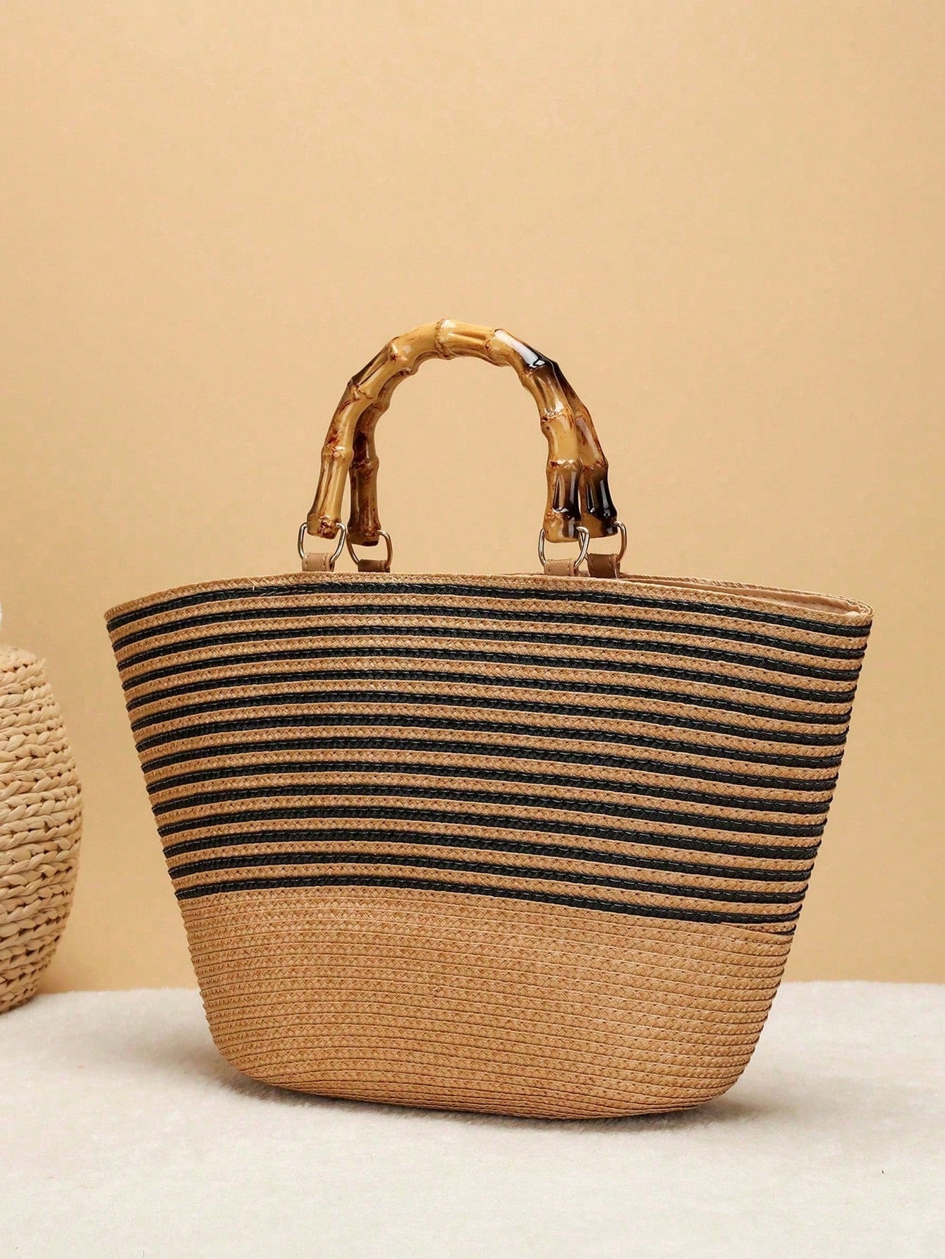Get ready to turn heads with this playful khaki striped beach bag! Featuring chic bamboo handles and a lightweight design, it’s perfect for carrying all your summer essentials with ease. Spacious enough for beach towels, snacks, and sunscreen, this bag is your go-to companion for casual outings and sunny vacations. Stylish, roomy, and oh-so-fun!