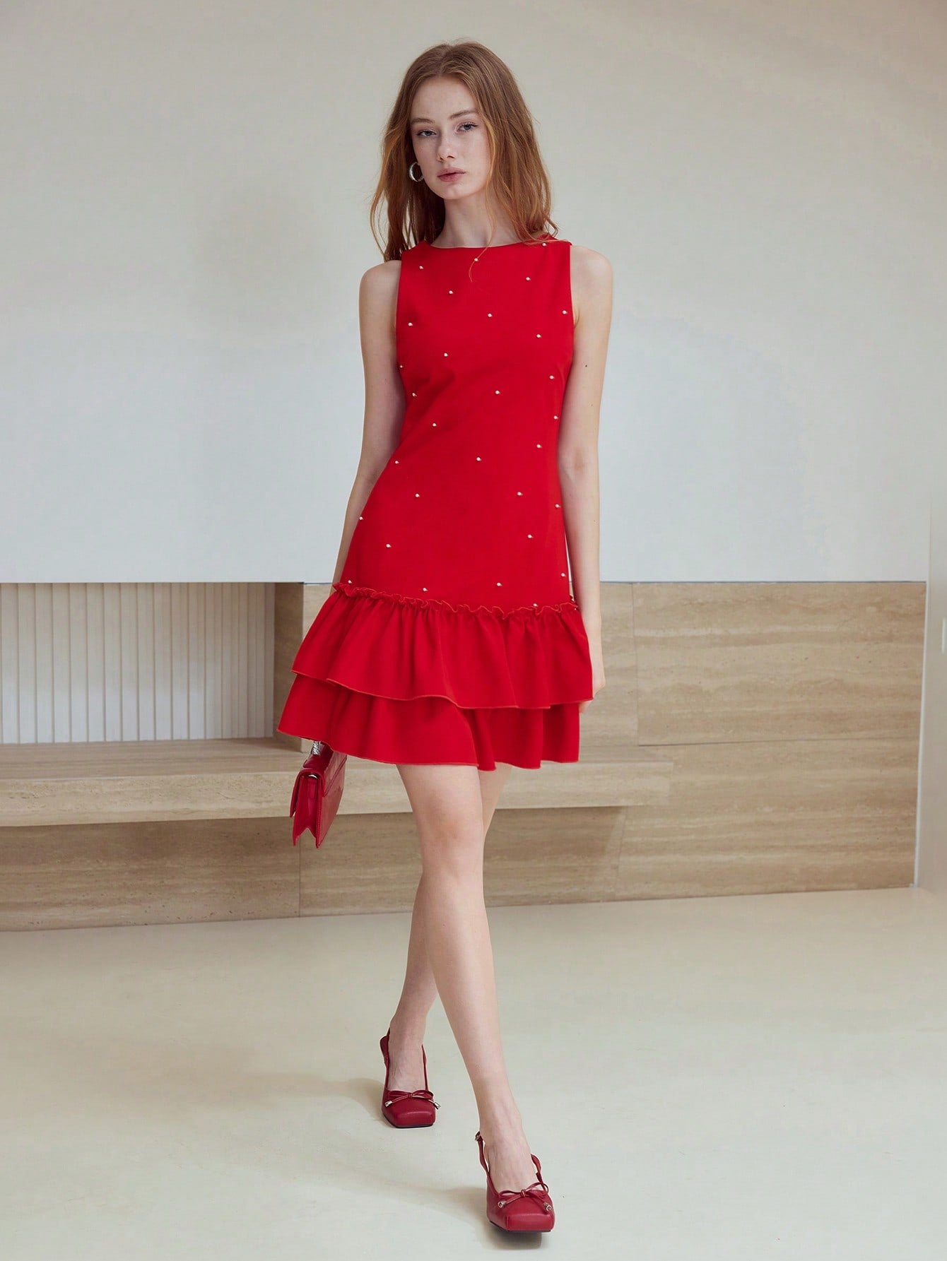 Step out in style with the Faux Pearl Ruffle Hem Dress, where elegance meets a playful twist. Delicate faux pearls add a touch of charm, while the flirty ruffle hem brings movement and fun to every step. Perfect for any occasion, this dress effortlessly blends chic sophistication with a lively spirit.