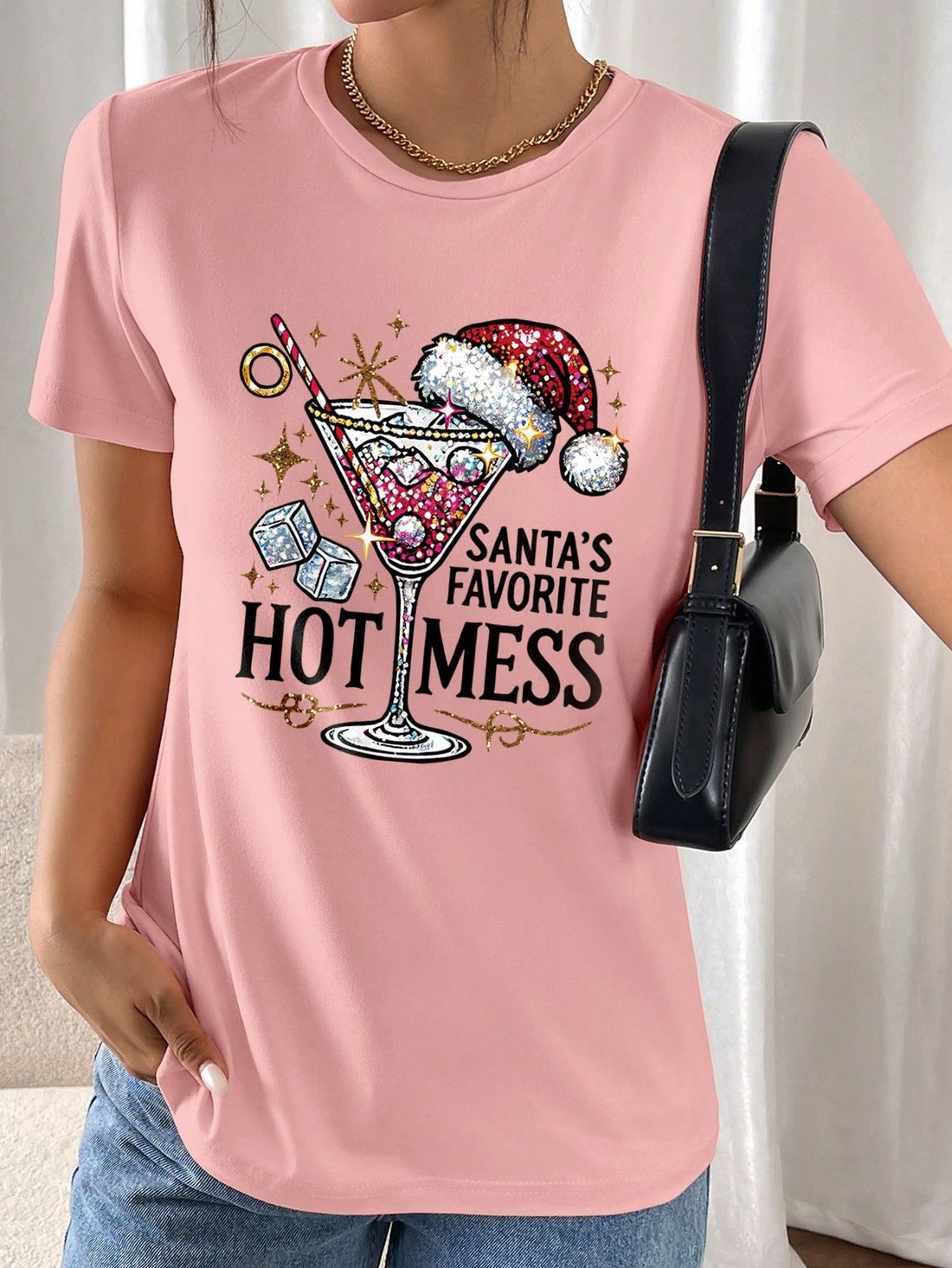 This festive Christmas wine glass graphic print tee for women is perfect for showing off your holiday spirit. Made with high-quality materials, it offers a comfortable fit and features a fun design that is sure to bring a smile to everyone's face. Get ready to spread some festive cheer with this festive tee!