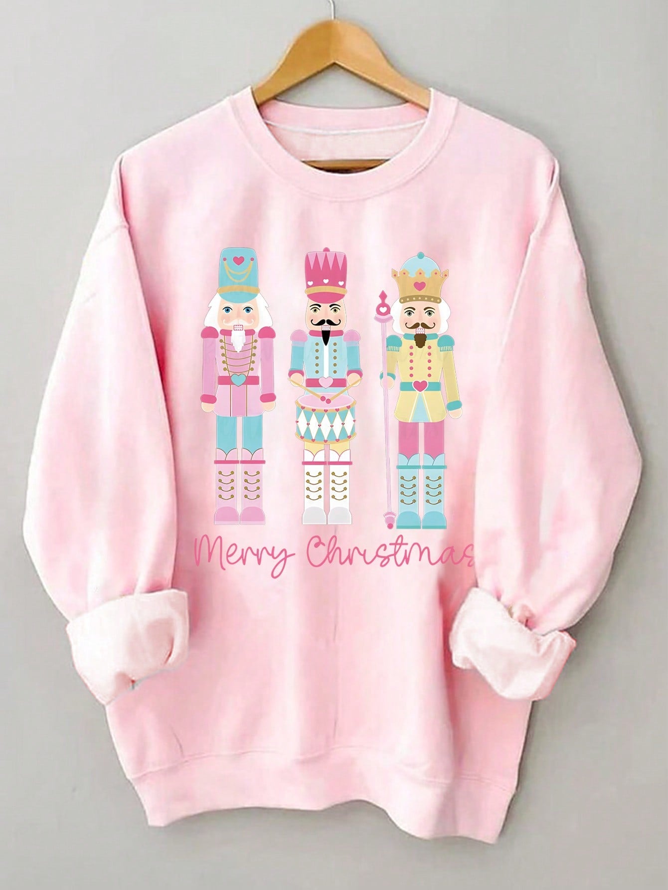 Introducing the Festive Nutcracker Sweatshirt: a cozy and stylish round neck Christmas apparel for women. Made with high-quality materials, this sweatshirt features a festive nutcracker design, perfect for spreading holiday cheer. Stay warm and comfortable while looking festive this season.