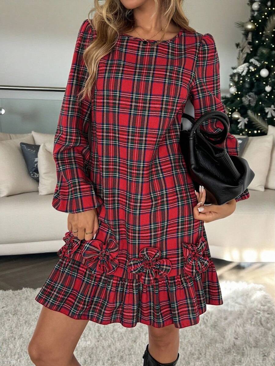 Celebrate the season in style with this charming red plaid mini dress that brings festive flair to your wardrobe. The whimsical lantern sleeves add a romantic touch, while the delicate floral ruffle hem creates an enchanting finishing detail. Perfect for holiday parties, seasonal gatherings, or whenever you want to embrace cheerful elegance. This playful piece combines classic plaid patterns with modern silhouette details for a look that's both timeless and trendy. Whether you're dancing at a winter celebra