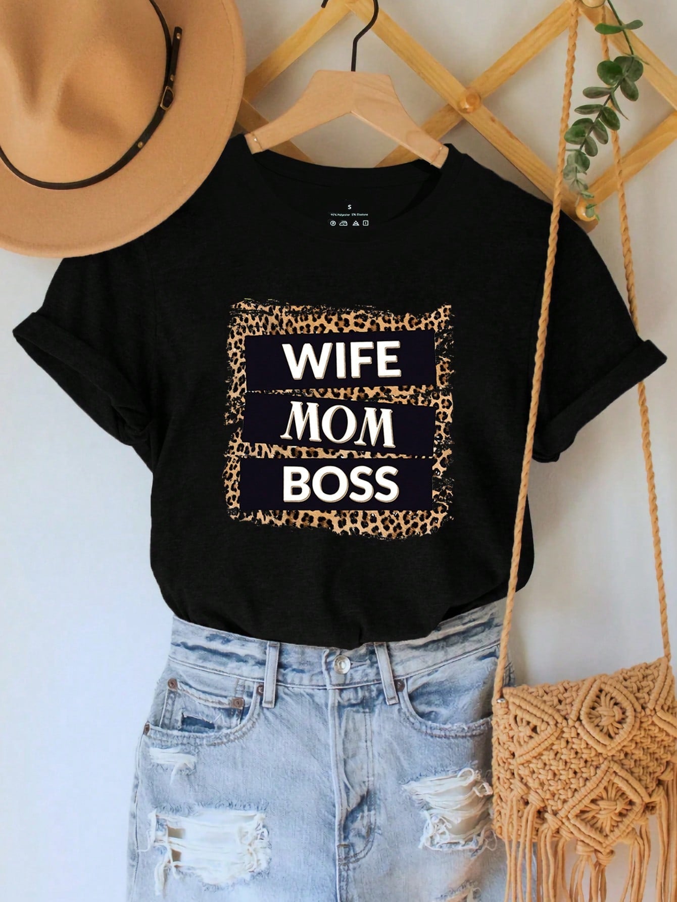 Unleash your inner fierceness with our Fierce & Fabulous: Leopard Print 'Wife, Mom, Boss' Graphic Tee. Show off your wild side and confident attitude with this playful and stylish statement piece. Perfect for any boss mom, this shirt will have heads turning and make you stand out in the best way possible. (Rawr!)