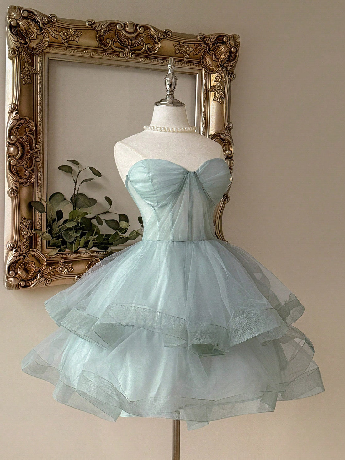 Step into the spotlight with this elegant gray-green pleated tube top dress. Its flattering pleats and sleek silhouette bring a playful charm perfect for special occasions. Whether you're dancing the night away or making a grand entrance, this dress combines comfort and style effortlessly to help you find your perfect look.