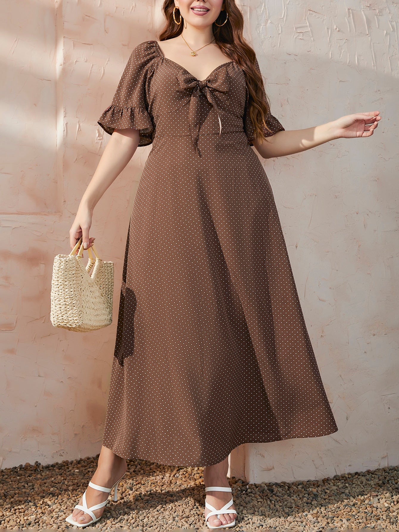 Embrace your curves in this playful polka dot A-line dress! The flounce sleeves add a flirty touch while the knot front detail creates a flattering silhouette. Perfect for summer brunches or evening strolls, this plus-size stunner lets you look fabulous without trying too hard. Just slip it on and you're ready to turn heads!