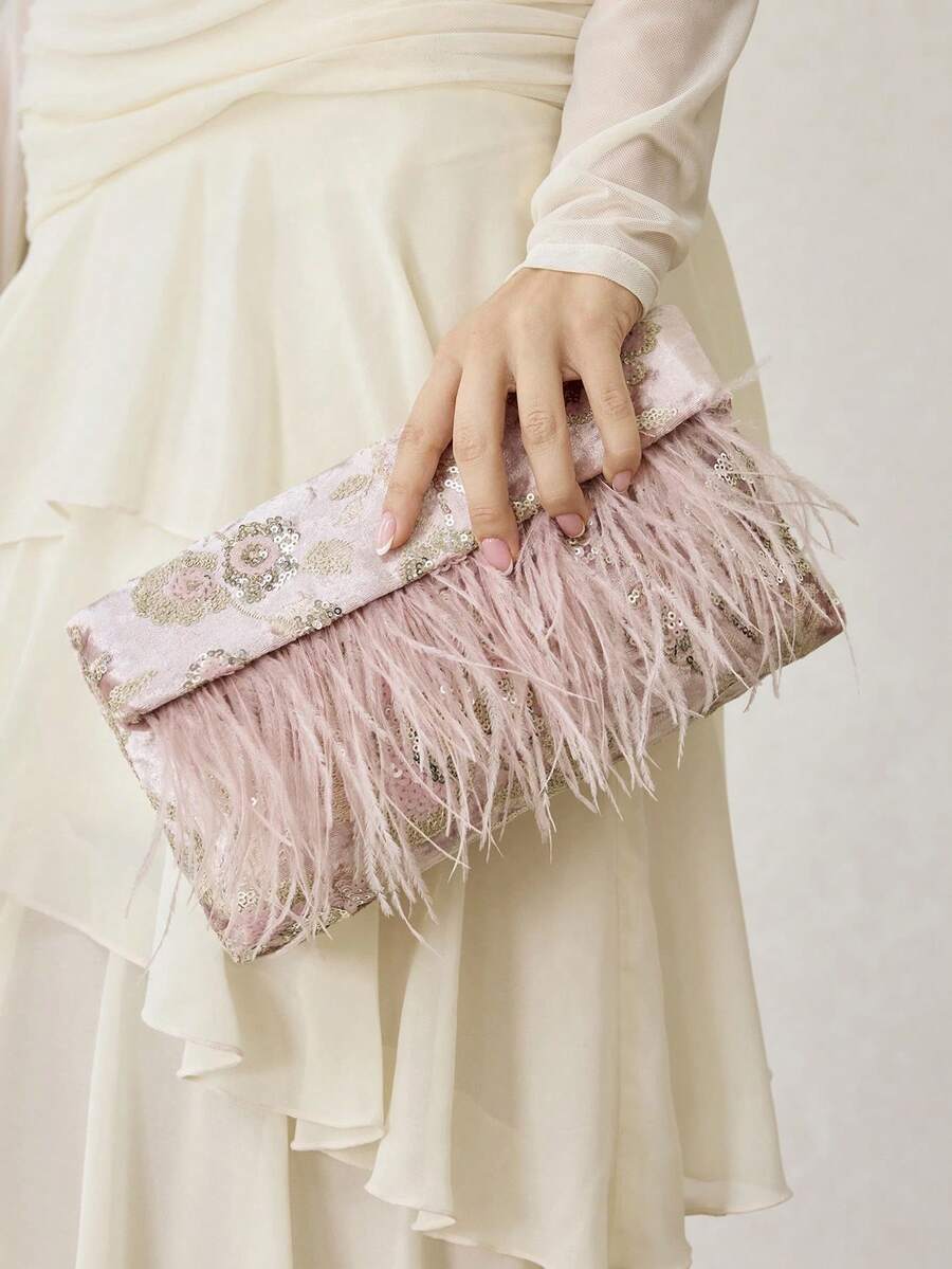 Turn every special occasion into a memorable one with this floral beaded clutch bag for women. Designed with intricate floral beadwork, elegant feather accents, and a sophisticated envelope silhouette, this evening purse brings timeless glamour to weddings, cocktail parties, galas, and formal celebrations.