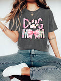 Unleash your love for your furry best friend with our Floral Cartoon 'Dog Mom' Graphic Tee! Perfect for dog lovers, this cute and casual summer top features a fun floral cartoon design and playfully proclaims your status as a proud 'dog mom'. Get yours today and wear it with pride!