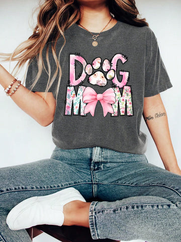 Unleash your love for your furry best friend with our Floral Cartoon 'Dog Mom' Graphic Tee! Perfect for dog lovers, this cute and casual summer top features a fun floral cartoon design and playfully proclaims your status as a proud 'dog mom'. Get yours today and wear it with pride!