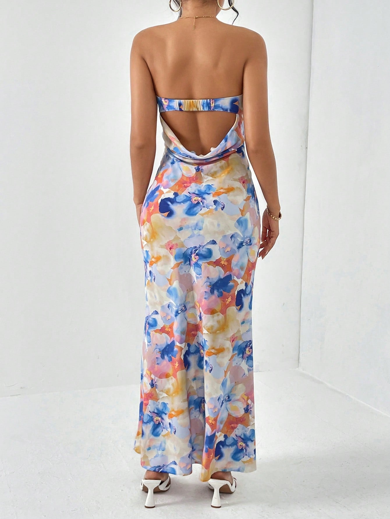 Embrace effortless spring break style with Floral Elegance's Backless Tube Summer Dress. Show off your playful side with its unique design and enjoy its breathable fabric during warm days. Feel confident and chic in this dress at any beach or pool party.