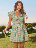 Step into playful charm with this Floral Embroidered Gingham Mini Dress. Featuring a flirty deep V-neck and ruffled sleeves, its western-inspired fit and flare silhouette adds a fun, feminine twist. The delicate floral embroidery on classic gingham brings a fresh, stylish vibe perfect for sunny days and casual outings.
