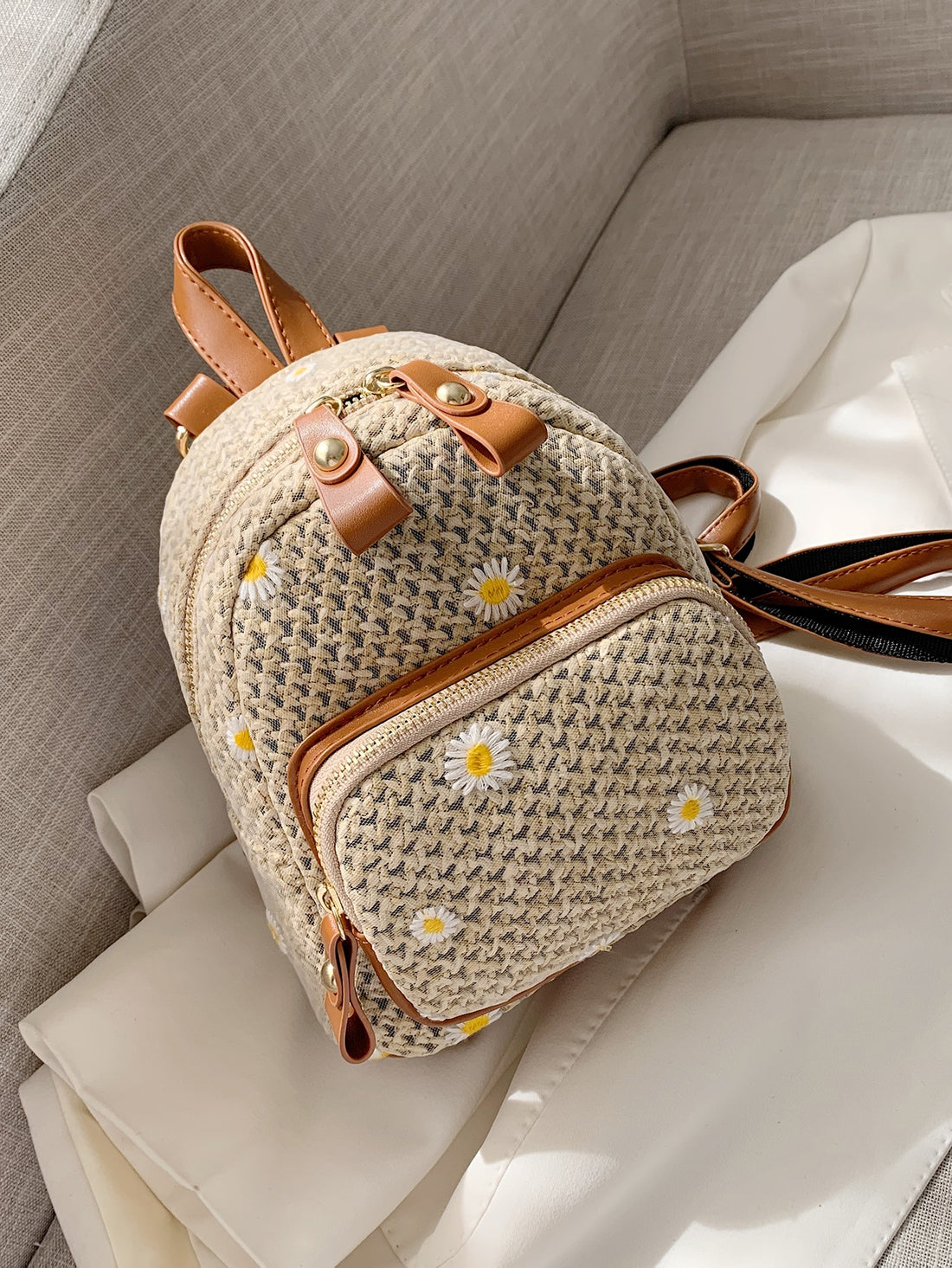 This Floral Embroidered Straw Backpack is the ultimate summer essential for every occasion. Its lightweight, breathable material is perfect for warm weather and the beautiful embroidered floral design adds a touch of elegance. With its spacious interior and comfortable straps, it's perfect for both practicality and style. 