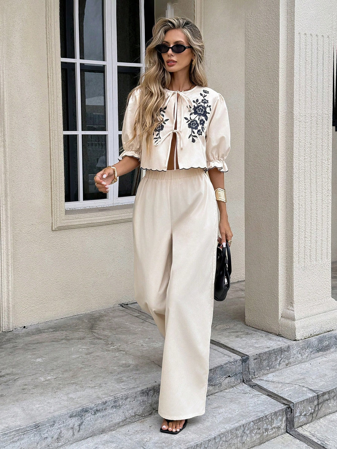 Elevate your wardrobe with this charming two-piece set that brings together style and comfort! The twist front top features delicate floral embroidery that adds a touch of elegance, while the coordinating pants complete the look with effortless sophistication. Perfect for brunch dates, casual outings, or whenever you want to feel put-together without trying too hard. Mix, match, or wear together—this versatile set is your new go-to for looking fabulous.