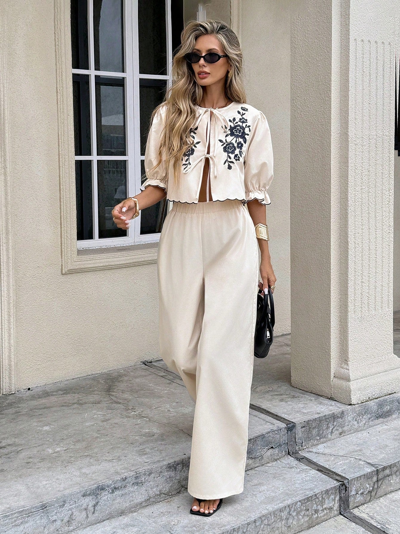 Elevate your wardrobe with this charming two-piece set that brings together style and comfort! The twist front top features delicate floral embroidery that adds a touch of elegance, while the coordinating pants complete the look with effortless sophistication. Perfect for brunch dates, casual outings, or whenever you want to feel put-together without trying too hard. Mix, match, or wear together—this versatile set is your new go-to for looking fabulous.