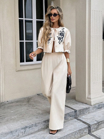 Elevate your wardrobe with this charming two-piece set that brings together style and comfort! The twist front top features delicate floral embroidery that adds a touch of elegance, while the coordinating pants complete the look with effortless sophistication. Perfect for brunch dates, casual outings, or whenever you want to feel put-together without trying too hard. Mix, match, or wear together—this versatile set is your new go-to for looking fabulous.