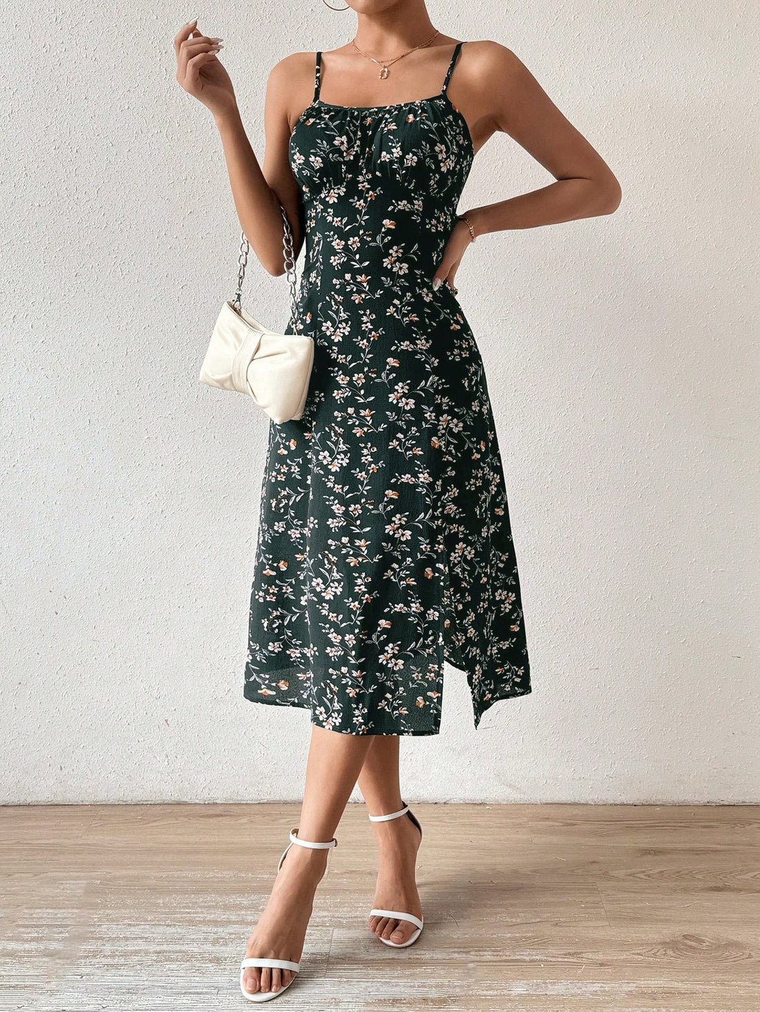 This Floral Essence dress features a delicate, feminine design with spaghetti straps and a stylish slit hem. Its floral pattern adds a touch of elegance to any occasion. Made with high-quality materials, it offers both comfort and style, making it a must-have for any fashion-forward individual.
