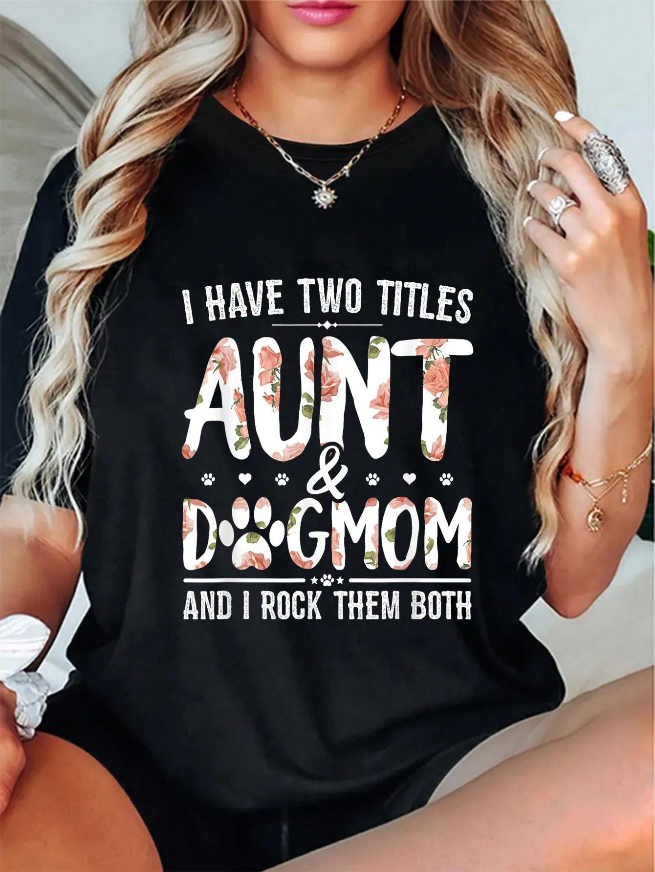 Be the ultimate dog lover with our 'Aunt & Dog Mom' graphic tee from Floral Fun. The perfect choice for dog-loving aunts, this tee is as playful and fun as your furry friends. Get ready to make a statement and show off your love for your pups with this quirky and stylish shirt!