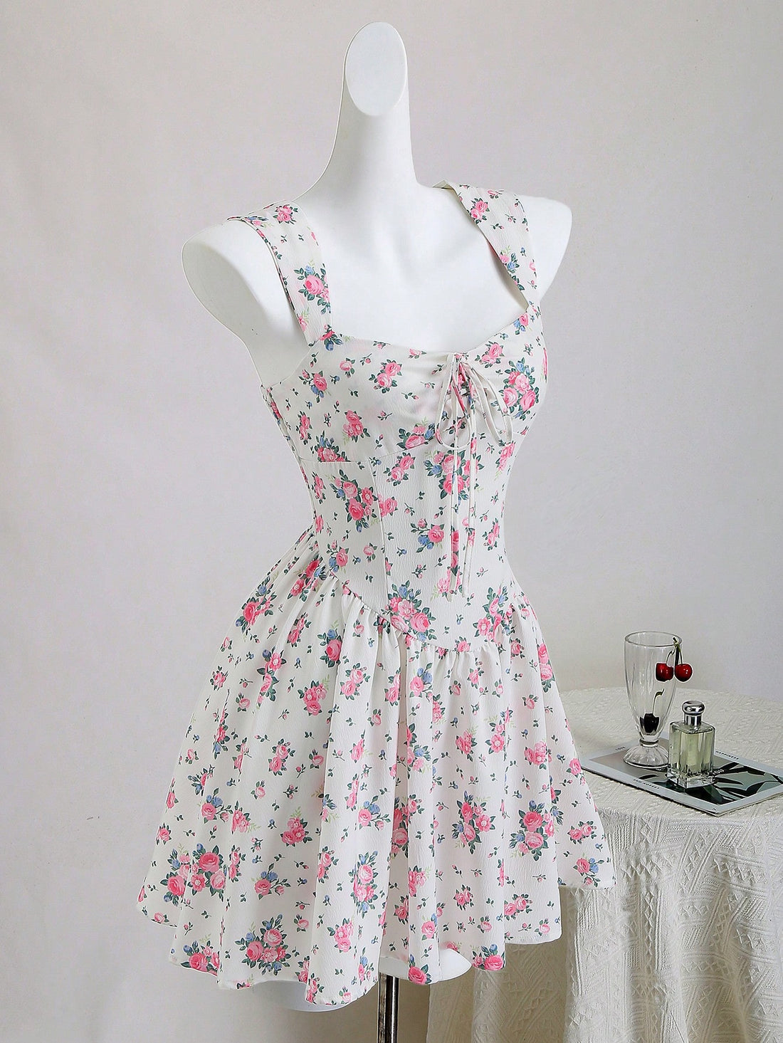 Step into sunshine with this playful vintage-inspired tie-front dress, perfect for effortless vacation vibes. Its cheerful floral pattern and relaxed fit make it a breezy choice for beach days or casual strolls. The tie-front detail adds a flirty touch, ensuring you look stylish while staying comfortable all day long.